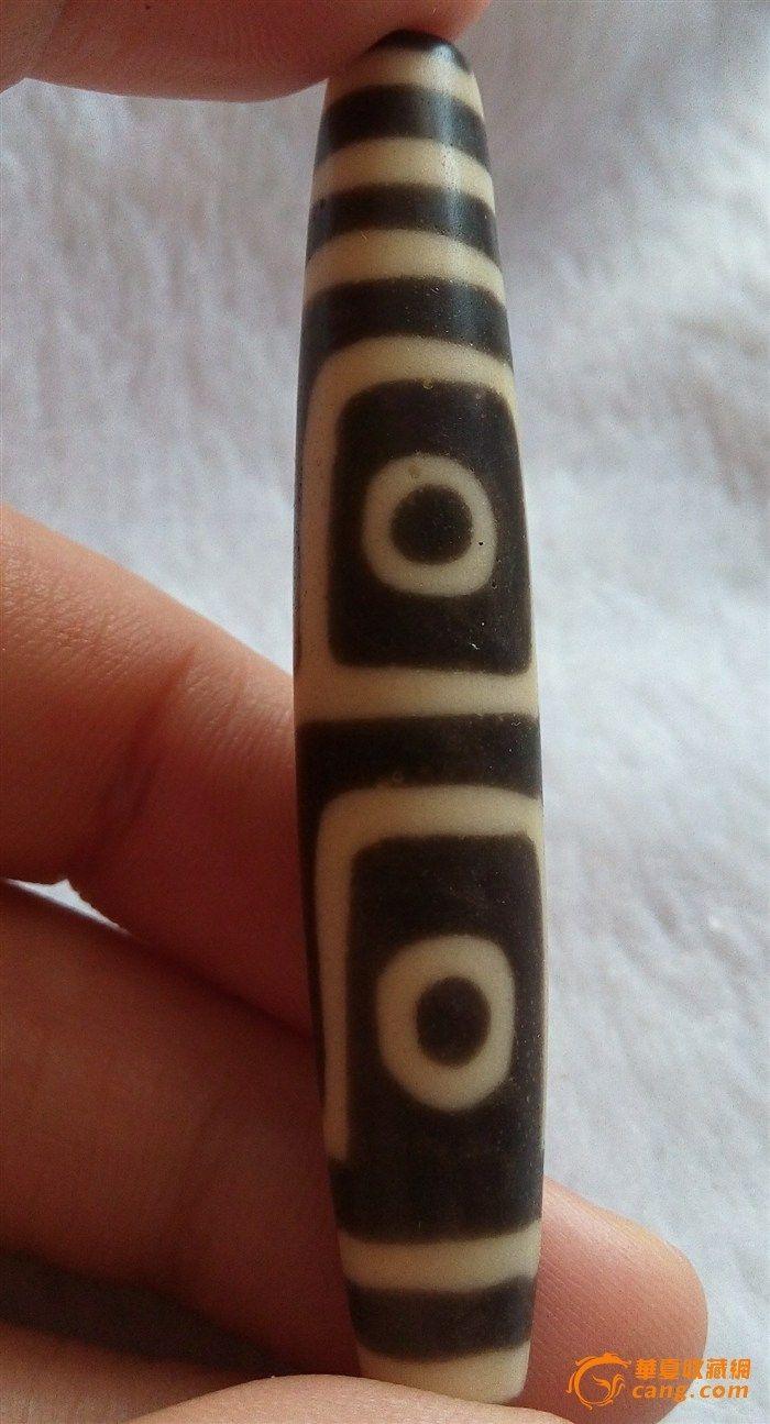 看看是不是老料四眼天珠?啥年代的?可否价值