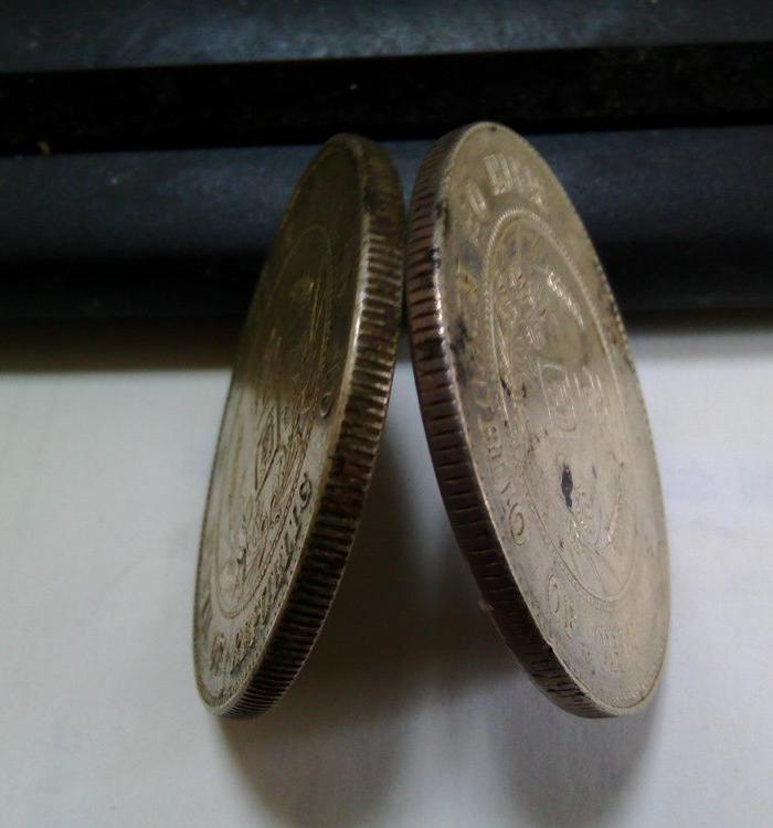 错版孙中山开国纪念币银币,背面英文单词字母